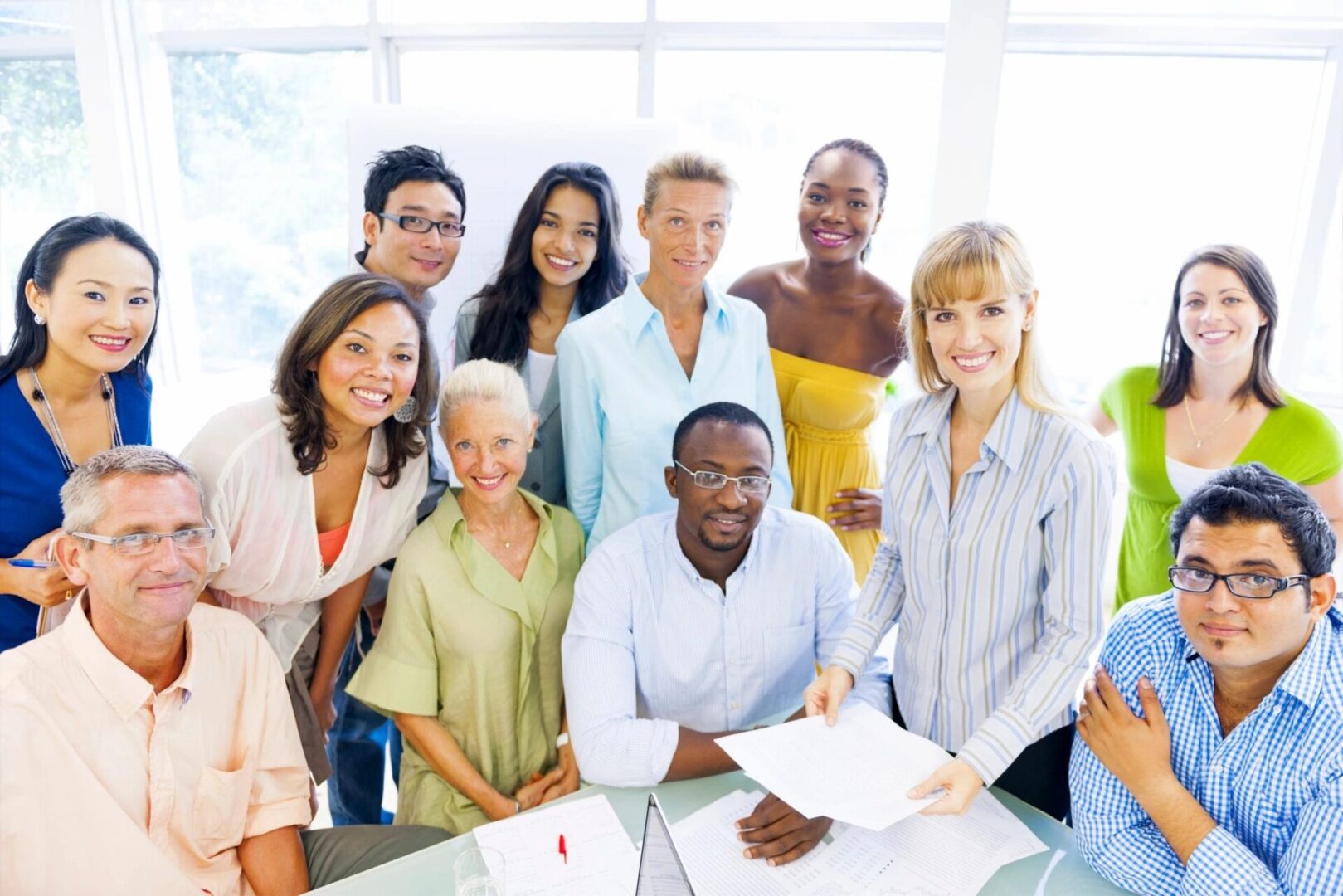 A group of people standing around each other.