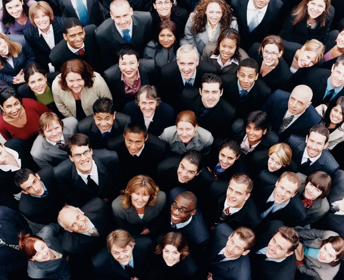 A group of people in suits and ties standing together.